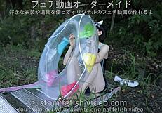 A woman inflating a float with air