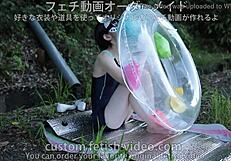 A woman inflating a float with air
