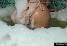 Charming shemale Amanda Fialho masturbates while in a bubble bath