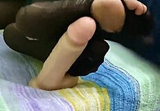 Watch me give a footjob with my dildo in torn pantyhose while masturbating doggystyle.