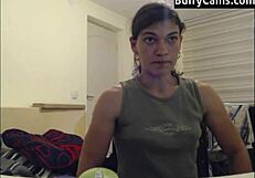 Athletic bodybuilder flexes biceps on camera