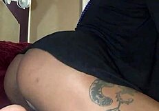 The ebony beauty enjoys some fun in bed with panties and thong.