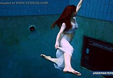 Amazing brunette shows off hairy body in underwater bikini.