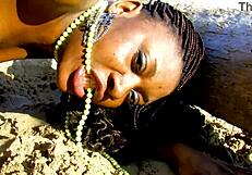 An erotic scene of a white man and a black woman near the sea coconut trees