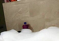 Cyno enjoys a relaxing bubble bath in cosplay.