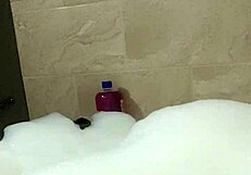 Cyno enjoys a relaxing bubble bath in cosplay.