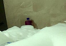 Cyno enjoys a relaxing bubble bath in cosplay.