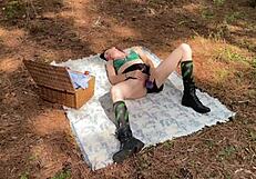 woman uses dildo for outdoor solo orgasm