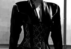 Bobbi masturbates in corset and stockings