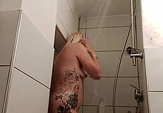 Alina enjoys soapy fun in the shower