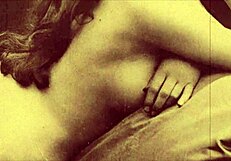 in this retro scene, a woman undresses and gives a blowjob