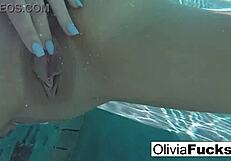 Horny blonde milf masturbates her pussy underwater with big tits