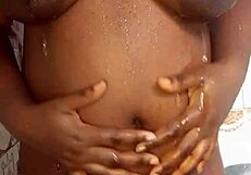 Ebony fucking herself in the bathroom