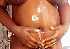 Ebony fucking herself in the bathroom