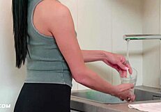 Beautiful brunette housekeeper licks landlord's cock in the kitchen. she helps him relax with her small tits.