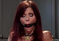 Bound milf housewife gags on master's cock in deep submission.