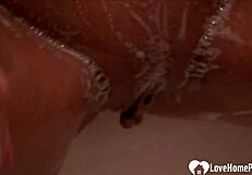 Solo blonde babe in shower masturbates her shaved pussy teasingly