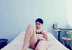 The hot young gay guy touches himself in his room while crossdressing