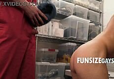 A small young gay boy is having oral sex with a macho janitor of his father