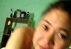 an amateur asian girl teases with her big tits before giving a blowjob on webcam