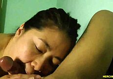 an amateur asian girl teases with her big tits before giving a blowjob on webcam