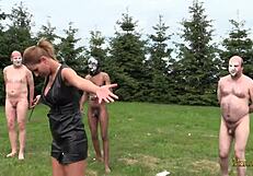 German mistress punishes slave in the camp!