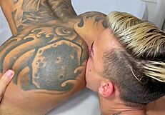 sucking tattooed hunk's big cock