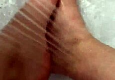 i take off my nylon stockings and step into the shower, teasing with my feet