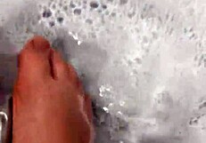 i take off my nylon stockings and step into the shower, teasing with my feet