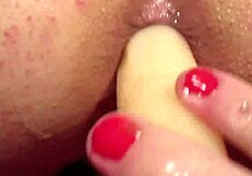 elly gets pounded from behind with dildo!