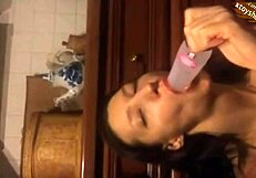 Young Russian amateur trying bottle tricks in hot Moscow setting