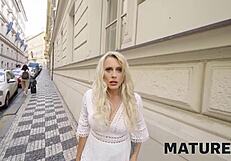 A mature blonde woman reveals her kinky side in a hotel room, getting caught in her cheating desires.