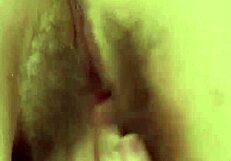 A shaved and innocent teen masturbates by stroking her pink lips until she reaches an orgasm.