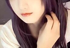 A cute girl with bobbed hair and pussy cat ears masturbates.