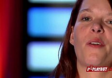 In the dimly lit room, a redhead couple engages in interracial passion as she receives oral pleasure on her pussy while performing fellatio on her black partner.