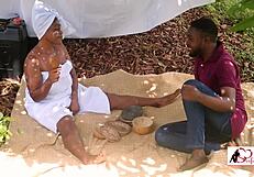 He bangs her bent over in doggystyle under the mango tree, group action intensifying