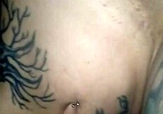 look at this tattooed beauty fingering her wet pussy