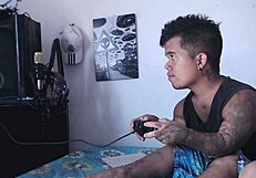 Horny stepsister plays with his cock while he games