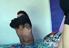 Horny stepsister plays with his cock while he games