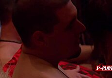 In the dimly lit room, a redhead couple engages in interracial passion as she receives oral pleasure on her pussy while performing fellatio on her black partner.