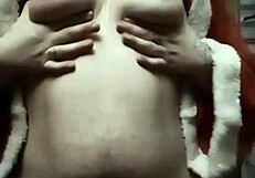 Natale massages her natural tits on show.