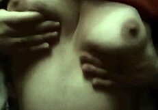 Natale massages her natural tits on show.