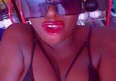 Mature ebony woman in lingerie pleasures her big tits endlessly