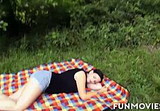 Tattooed brunette undresses nude outdoors, masturbating hairless pussy while getting handjob and cum on big jugs.