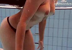 Hot Russian girl swims naked in the pool