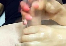 Oiled Tits Lead to Explosive Cumshot from Handjob