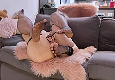 Cute teen 18+ fucks herself with a dildo on a couch