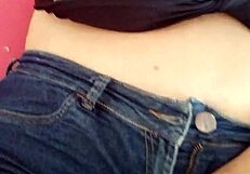 pretty girl moans while masturbating in shorts