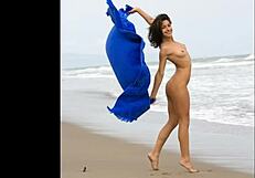 Modelz Beauty Poses Elegantly in the Sand