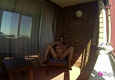 Sara Ray masturbates on a balcony for everyone in Madrid to see. Want to watch her play with that dildo in public?